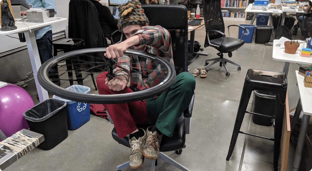 person holding bike tire sideways